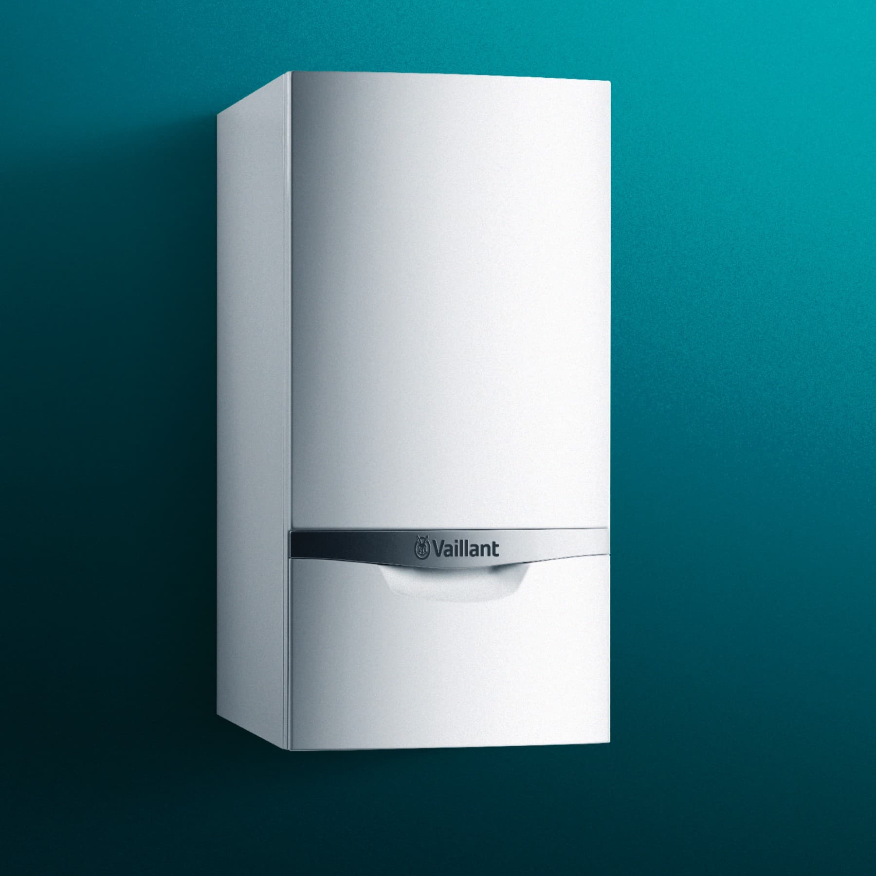 Ein Gas-Brennwertgerät von Vaillant hängt an einer grünen Wand.