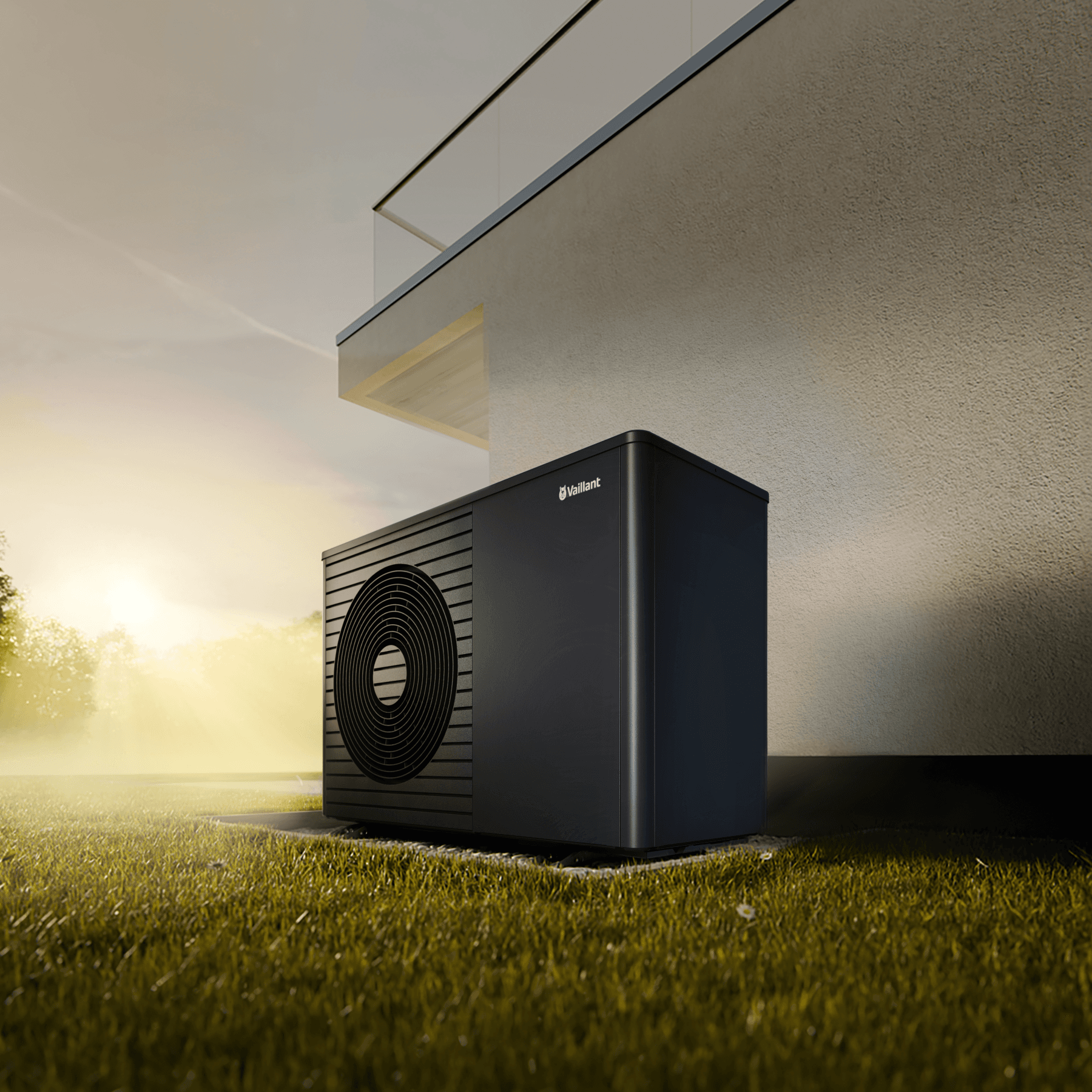Wärmepumpe aroTHERM plus vor Hauswand mit Sonnenuntergang im Hintergrund